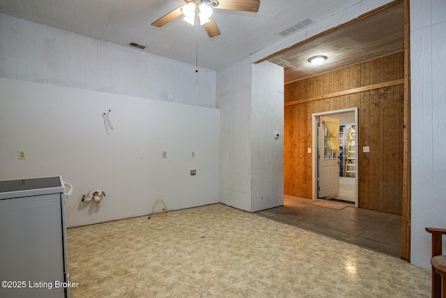 201 Wildflower Ln, Big Springs, KY 40175 - unfurnished room with ceiling fan, wood walls, tile patterned floors, and washer / clothes dryer