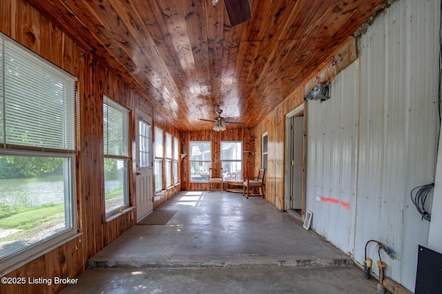 201 Wildflower Ln, Big Springs, KY 40175 - unfurnished sunroom with unfinished concrete flooring and wood walls