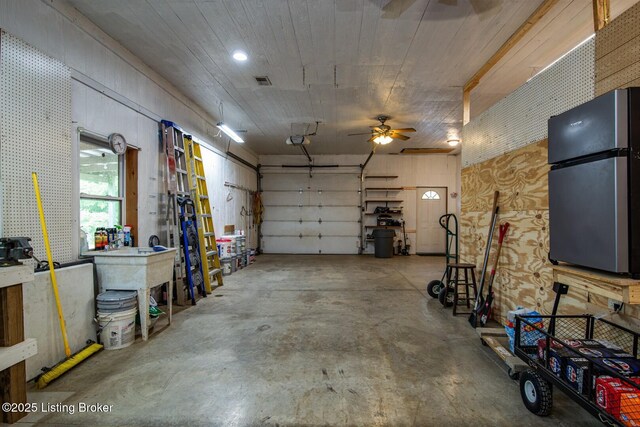201 Wildflower Ln, Big Springs, KY 40175 - garage with freestanding refrigerator, a garage door opener, and a ceiling fan