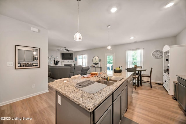 11915 Parkside Vista Ln, Louisville, KY 40229 - kitchen featuring light wood-style floors, a sink, healthy amount of natural light, baseboards, and recessed lighting