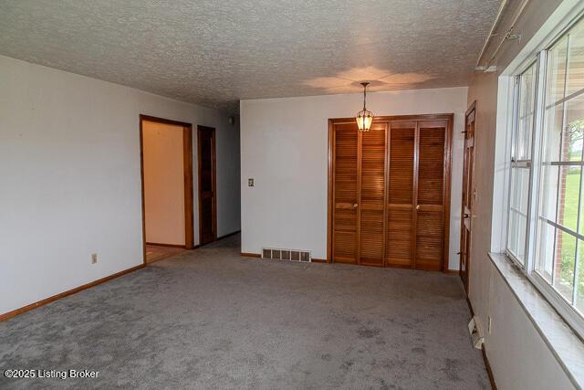 3110 Mount Lebanon Rd, Charlestown, IN 47111 - spare room with carpet, a textured ceiling, and baseboards