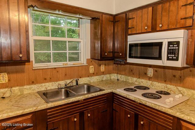 3110 Mount Lebanon Rd, Charlestown, IN 47111 - kitchen featuring white appliances, a sink, and light countertops