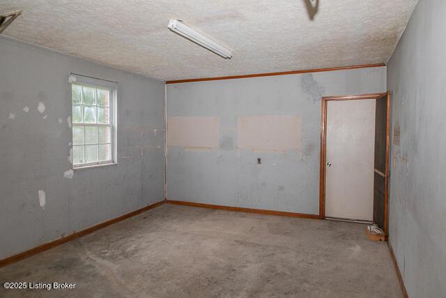 3110 Mount Lebanon Rd, Charlestown, IN 47111 - spare room featuring a textured ceiling and carpet flooring