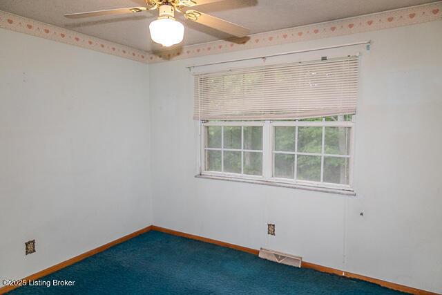 3110 Mount Lebanon Rd, Charlestown, IN 47111 - carpeted empty room featuring a ceiling fan and baseboards