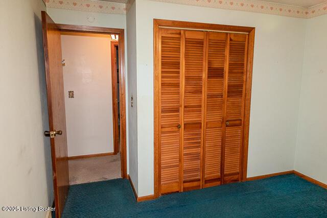 3110 Mount Lebanon Rd, Charlestown, IN 47111 - unfurnished bedroom featuring a closet, carpet flooring, and baseboards