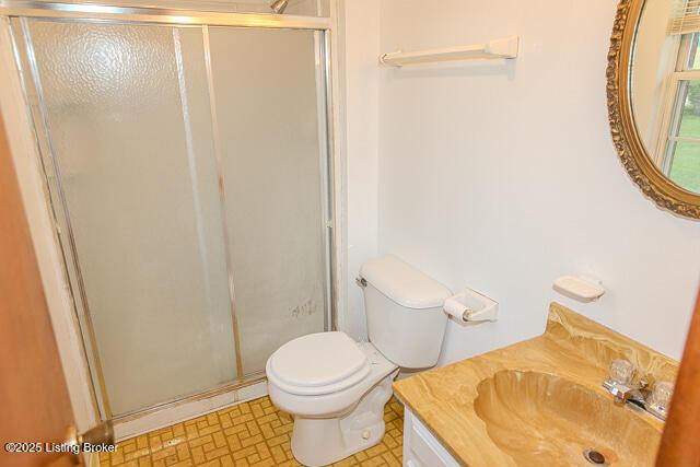 3110 Mount Lebanon Rd, Charlestown, IN 47111 - bathroom featuring vanity, a shower stall, and toilet