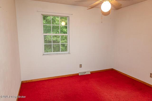 3110 Mount Lebanon Rd, Charlestown, IN 47111 - empty room featuring carpet, ceiling fan, and baseboards