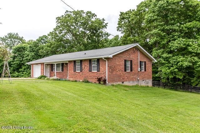 3110 Mount Lebanon Rd, Charlestown, IN 47111 - ranch-style home featuring a garage, brick siding, view of wooded area, and crawl space