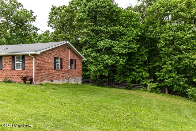 3110 Mount Lebanon Rd, Charlestown, IN 47111 - view of side of property with brick siding and crawl space