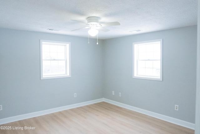 1206 W Walnut St, Danville, KY 40422 - empty room featuring light wood-type flooring, ceiling fan, and a textured ceiling