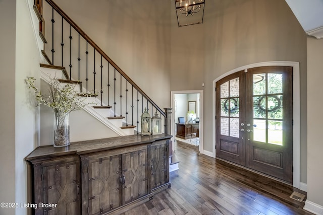 12406 Poplar Woods Dr, Goshen, KY 40026 - entrance foyer with french doors, dark wood-style flooring, stairs, a towering ceiling, and baseboards