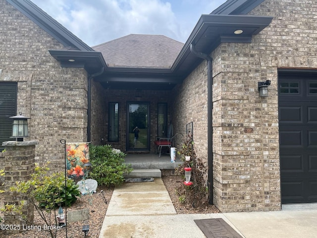140 Ranch Ln, Loretto, KY 40037 - doorway to property with roof with shingles, a porch, brick siding, and a garage