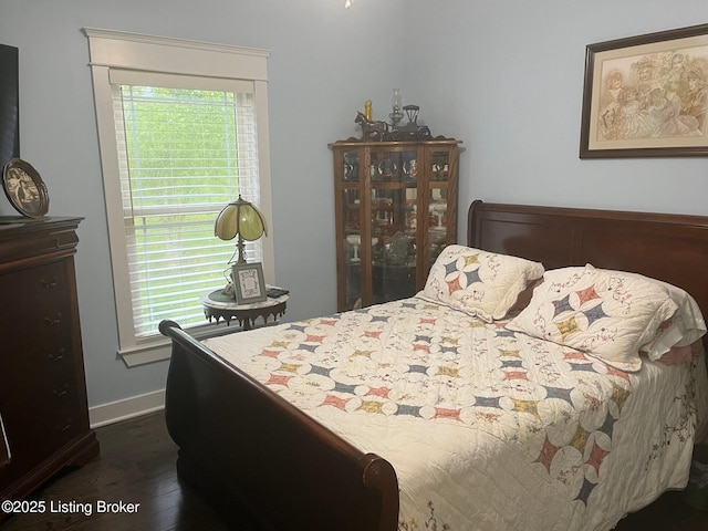 140 Ranch Ln, Loretto, KY 40037 - bedroom featuring dark wood-style floors, multiple windows, and baseboards