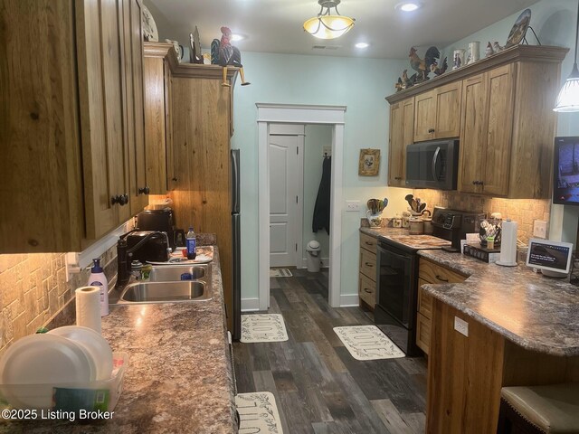 140 Ranch Ln, Loretto, KY 40037 - kitchen featuring black appliances, a sink, backsplash, dark wood-style flooring, and brown cabinets