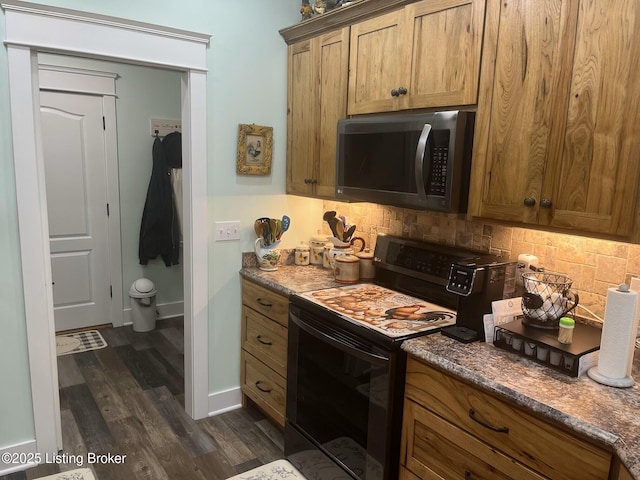 140 Ranch Ln, Loretto, KY 40037 - kitchen with electric range, dark wood finished floors, backsplash, and brown cabinets