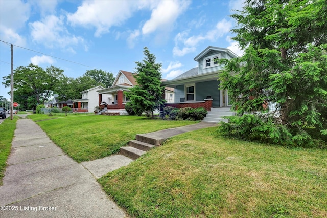 3707 Lentz Ave, Louisville, KY 40215 - view of front of property featuring brick siding, a porch, and a front lawn