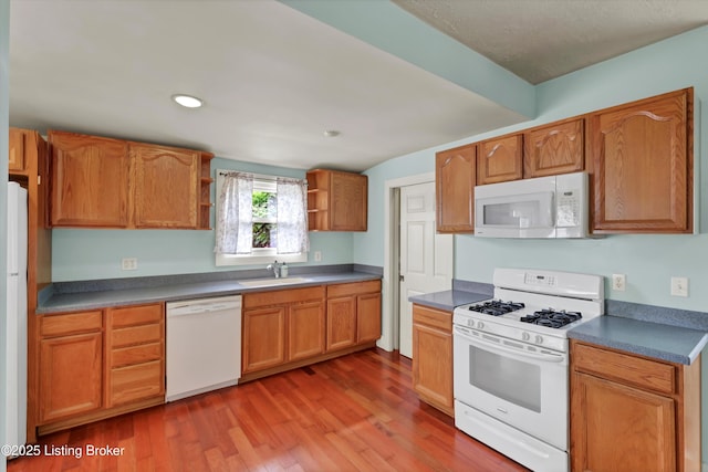 3707 Lentz Ave, Louisville, KY 40215 - kitchen with white appliances, open shelves, wood finished floors, a sink, and recessed lighting