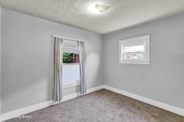 3707 Lentz Ave, Louisville, KY 40215 - spare room with carpet, a textured ceiling, and baseboards