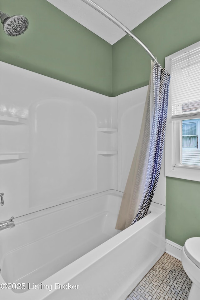 3707 Lentz Ave, Louisville, KY 40215 - bathroom featuring shower / bath combo with shower curtain, toilet, baseboards, and tile patterned flooring