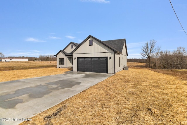 488 Capps Rd, Campbellsville, KY 42718 - modern inspired farmhouse with concrete driveway, central air condition unit, an attached garage, and a front yard