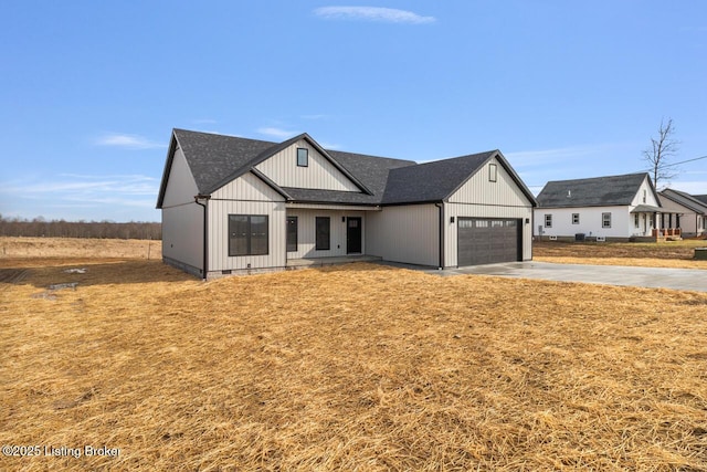 488 Capps Rd, Campbellsville, KY 42718 - modern inspired farmhouse featuring concrete driveway, a garage, and roof with shingles