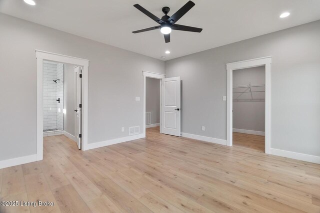 488 Capps Rd, Campbellsville, KY 42718 - unfurnished bedroom featuring light wood-style floors, baseboards, recessed lighting, a spacious closet, and ensuite bathroom