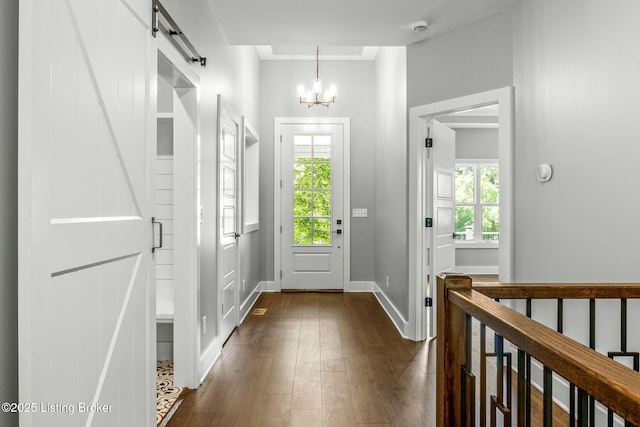 912 Artisan Pkwy, La Grange, KY 40031 - foyer with dark wood finished floors, a chandelier, a barn door, and baseboards