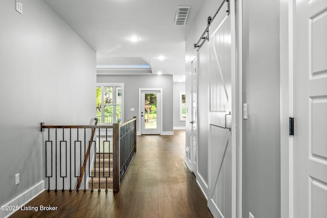 912 Artisan Pkwy, La Grange, KY 40031 - hallway featuring an upstairs landing, dark wood-style flooring, a barn door, baseboards, and recessed lighting