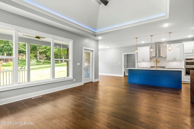 912 Artisan Pkwy, La Grange, KY 40031 - unfurnished living room featuring ceiling fan, dark wood-type flooring, recessed lighting, baseboards, and a sink