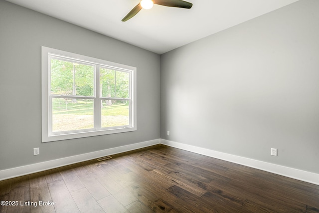 912 Artisan Pkwy, La Grange, KY 40031 - spare room featuring a ceiling fan, baseboards, and dark wood-style floors