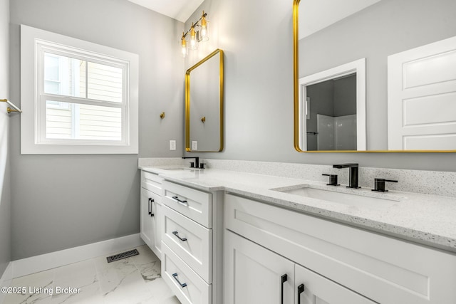 912 Artisan Pkwy, La Grange, KY 40031 - full bath with double vanity, marble look tiles, and baseboards