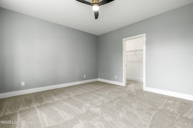 912 Artisan Pkwy, La Grange, KY 40031 - unfurnished bedroom featuring carpet flooring, a walk in closet, baseboards, ceiling fan, and a closet