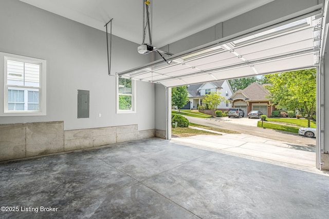 912 Artisan Pkwy, La Grange, KY 40031 - garage featuring electric panel and a garage door opener
