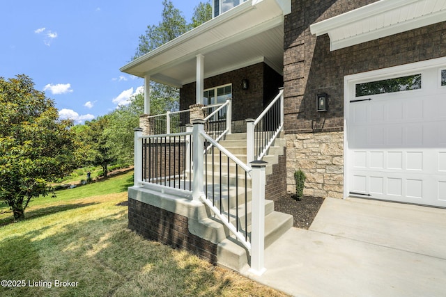 912 Artisan Pkwy, La Grange, KY 40031 - entrance to property with a porch, a lawn, an attached garage, stone siding, and brick siding