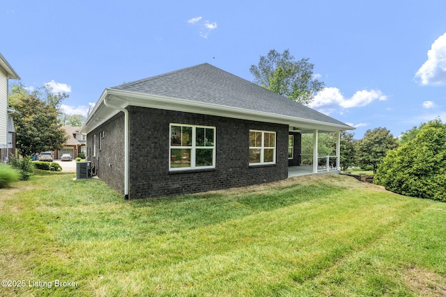 912 Artisan Pkwy, La Grange, KY 40031 - back of property with cooling unit, a yard, brick siding, and a shingled roof
