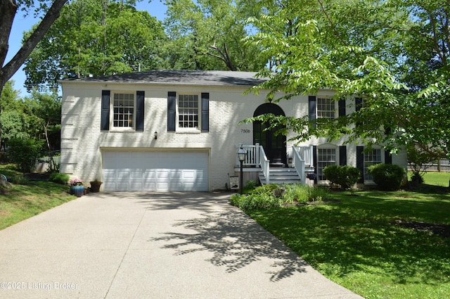 7506 Greenlawn Rd, Louisville, KY 40242 - view of front of house with driveway, brick siding, a front lawn, and an attached garage