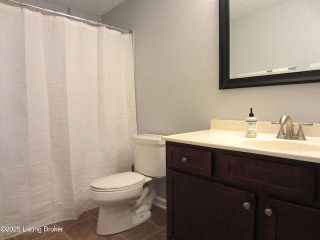 7506 Greenlawn Rd, Louisville, KY 40242 - full bath with toilet, vanity, tile patterned floors, and a textured ceiling