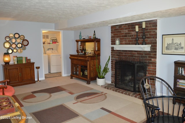 7506 Greenlawn Rd, Louisville, KY 40242 - living room featuring a textured ceiling, washing machine and dryer, a brick fireplace, and carpet floors