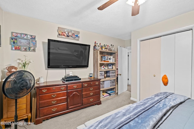 1261 Lipps Ln, Louisville, KY 40219 - carpeted bedroom with a closet, a textured ceiling, and ceiling fan