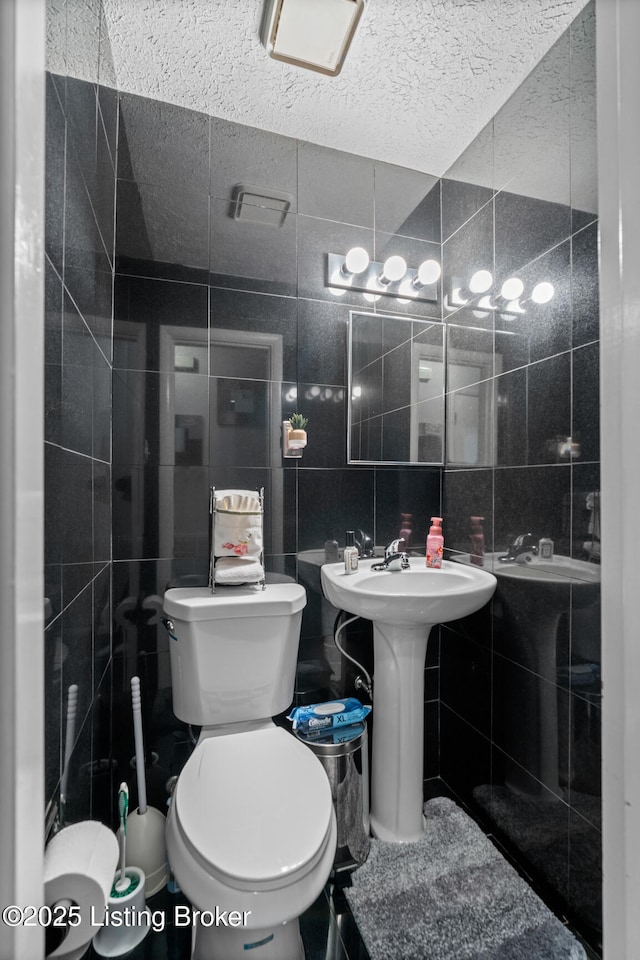 1261 Lipps Ln, Louisville, KY 40219 - half bath with toilet, tile walls, and a sink