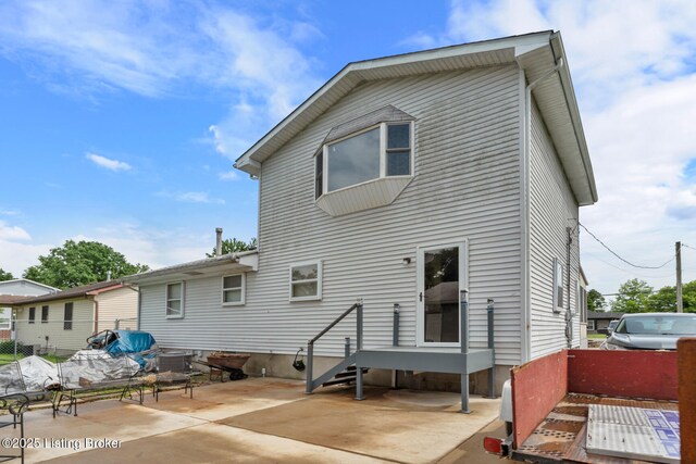 1261 Lipps Ln, Louisville, KY 40219 - rear view of house featuring a patio