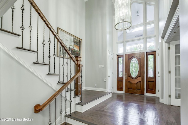 603 Woodlake Dr, Louisville, KY 40245 - foyer with a towering ceiling, baseboards, a chandelier, and stairs