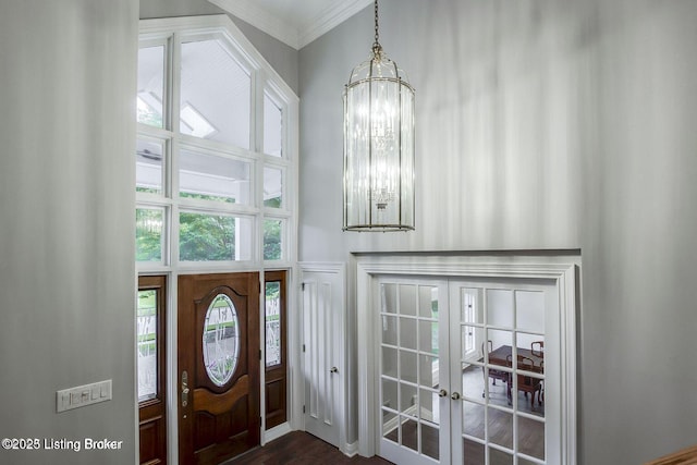 603 Woodlake Dr, Louisville, KY 40245 - entryway with french doors, crown molding, a chandelier, dark wood-style floors, and a high ceiling