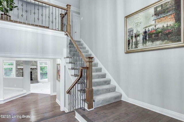 603 Woodlake Dr, Louisville, KY 40245 - stairway with hardwood / wood-style floors, baseboards, and a fireplace