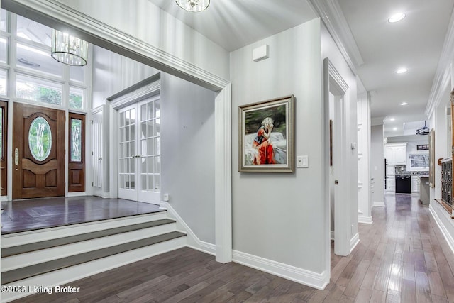 603 Woodlake Dr, Louisville, KY 40245 - foyer featuring wood finished floors, baseboards, ornamental molding, and recessed lighting