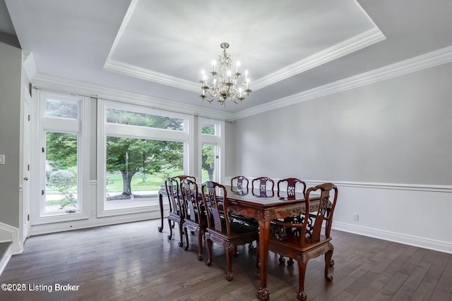 603 Woodlake Dr, Louisville, KY 40245 - dining area featuring a chandelier, healthy amount of natural light, dark wood-style floors, a tray ceiling, and crown molding