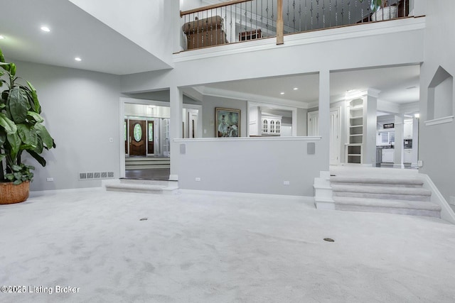 603 Woodlake Dr, Louisville, KY 40245 - unfurnished living room featuring a towering ceiling, carpet flooring, recessed lighting, and baseboards