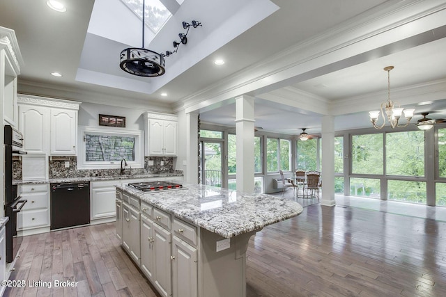 603 Woodlake Dr, Louisville, KY 40245 - kitchen featuring black dishwasher, stainless steel gas stovetop, white cabinets, decorative columns, and backsplash
