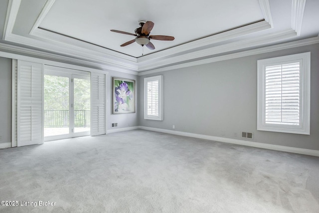 603 Woodlake Dr, Louisville, KY 40245 - empty room featuring a raised ceiling, ornamental molding, carpet floors, a ceiling fan, and baseboards