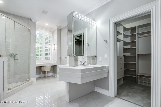603 Woodlake Dr, Louisville, KY 40245 - full bathroom featuring crown molding, a spacious closet, baseboards, a shower stall, and tile patterned floors